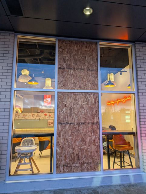 Emergency board-up of a broken storefront window