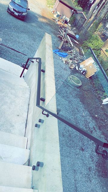 Custom glass stair railing installation
